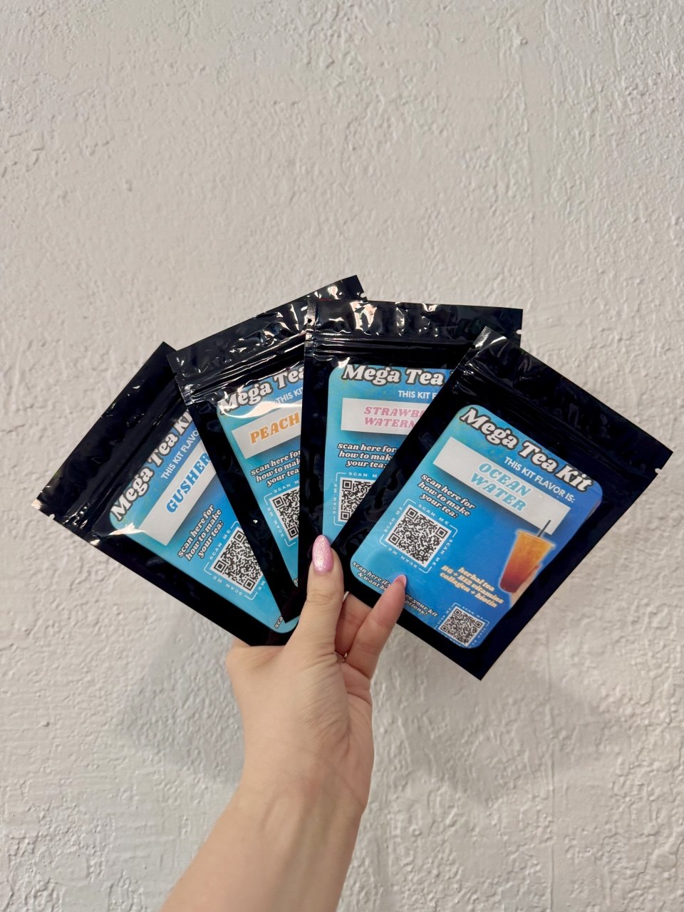 Mega Tea Kit packets with QR codes — Gusher, Peach, Strawberry Watermelon, Ocean Water